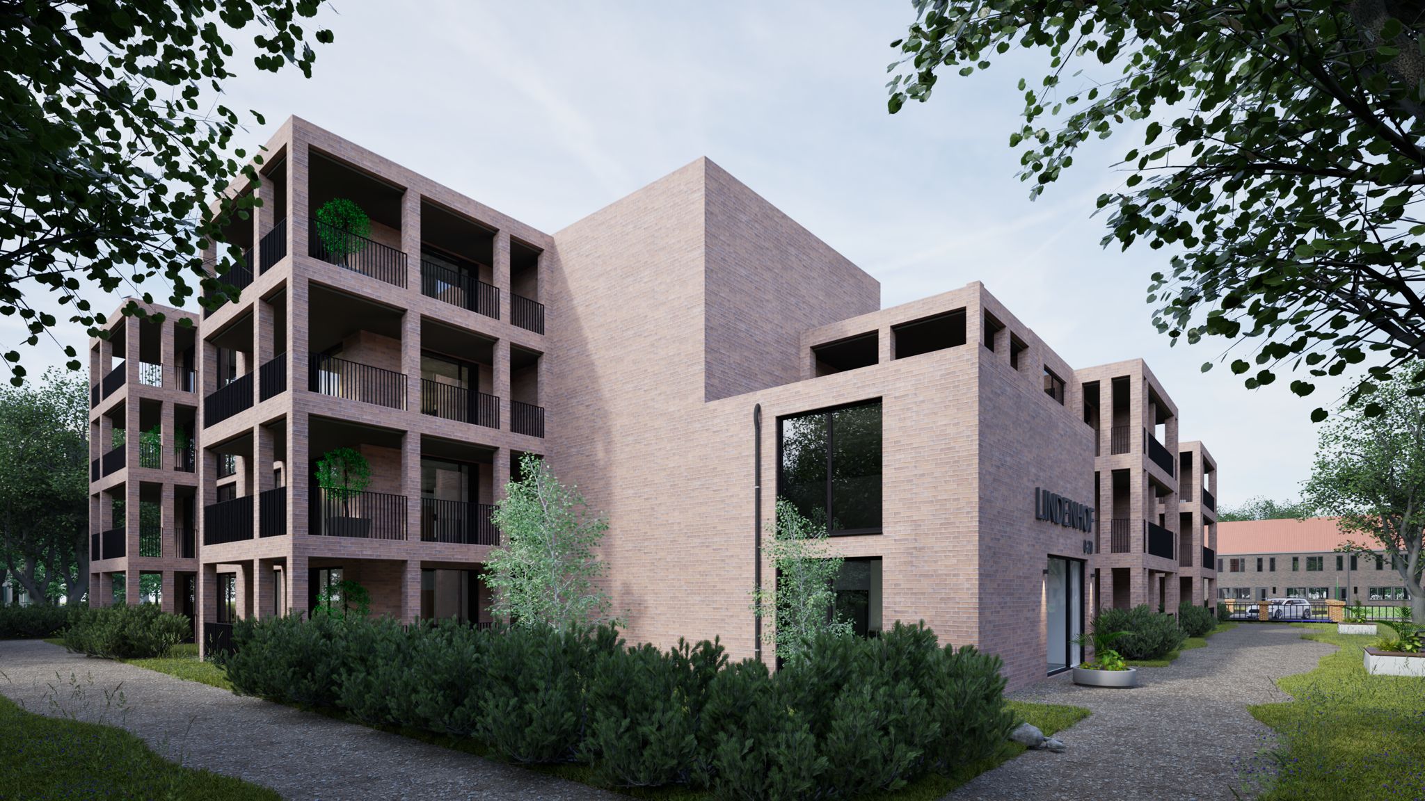 Corner perspective of Lindenhof in a green setting